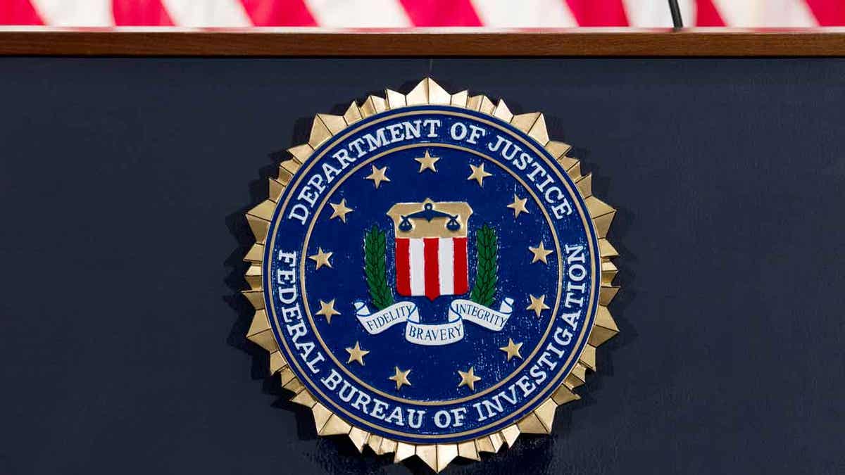 FBI logo and shield on dark background