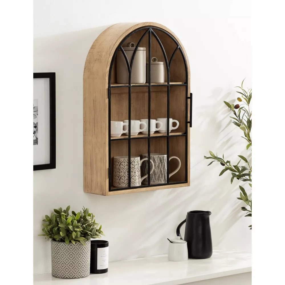 Wall-mounted wooden shelf with black metal framing.